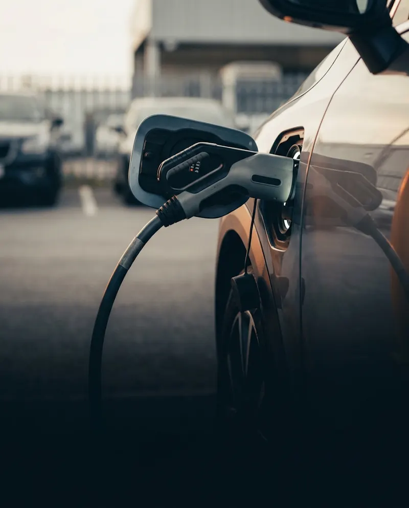 Electric car plugged into a charging cable